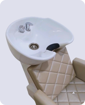 A black leather armchair with dark wood arms in a modern room setting.